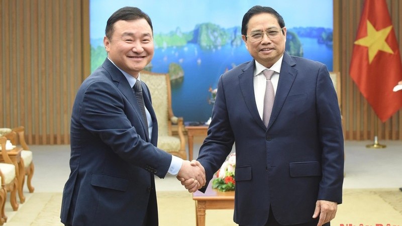 范明正总理会见韩国三星电子总裁卢泰文。（陈海 摄）