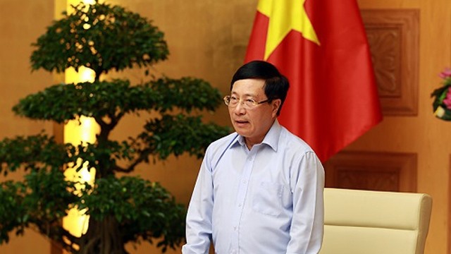 越南政府副总理兼外长范平明在会上发言。